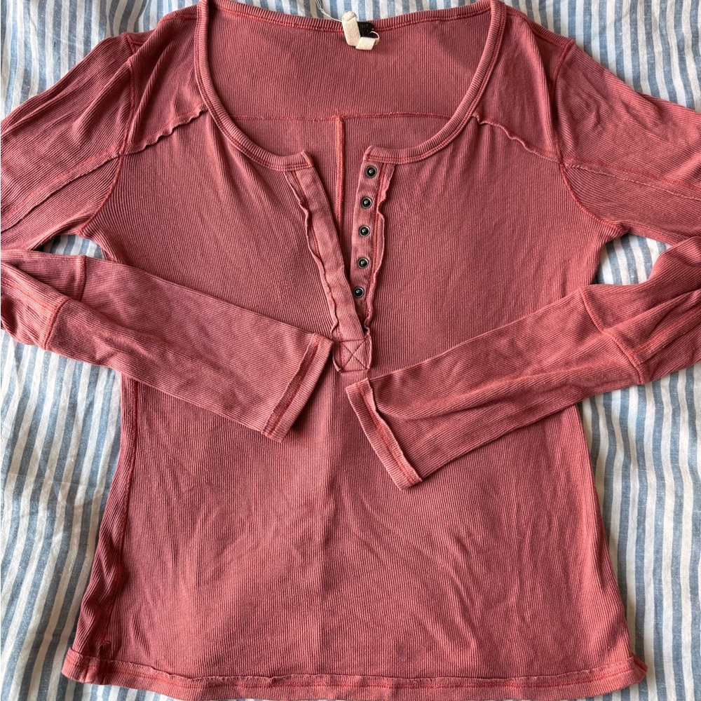 Free People ribbed long-sleeve henley top. Snaps on front.